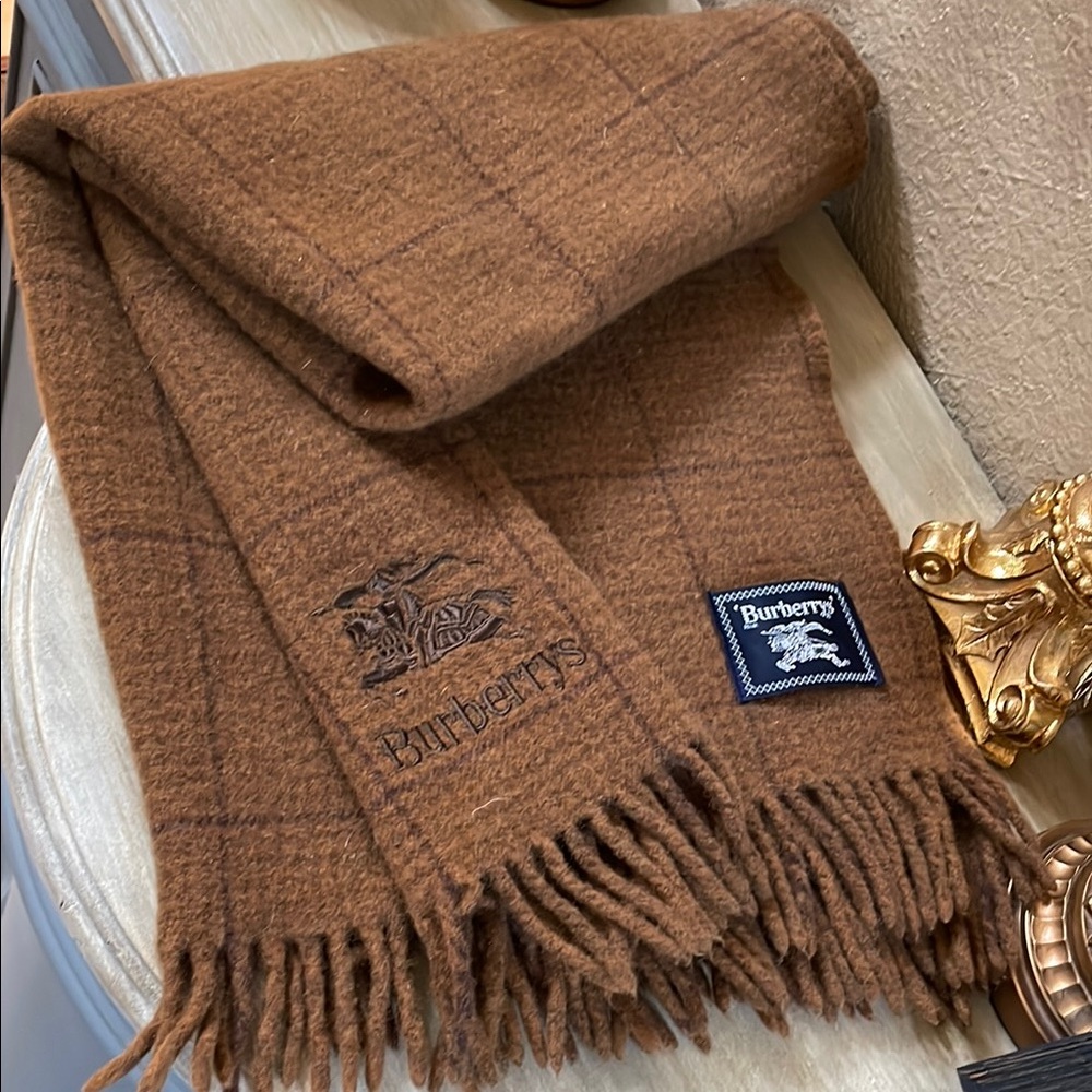 Burberry’s 100 % Wool Scarf . Excellent like new . Authentic . Brown and black